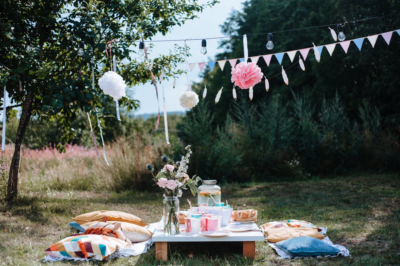 Beautiful outdoor garden setup with decorations, perfect for a summer party.